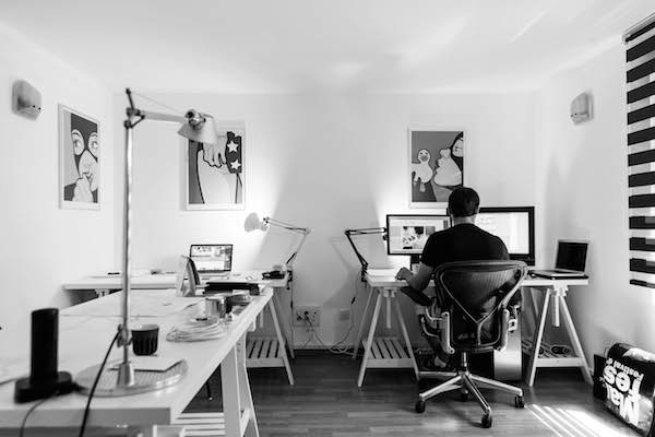 man working in his home office and being productive