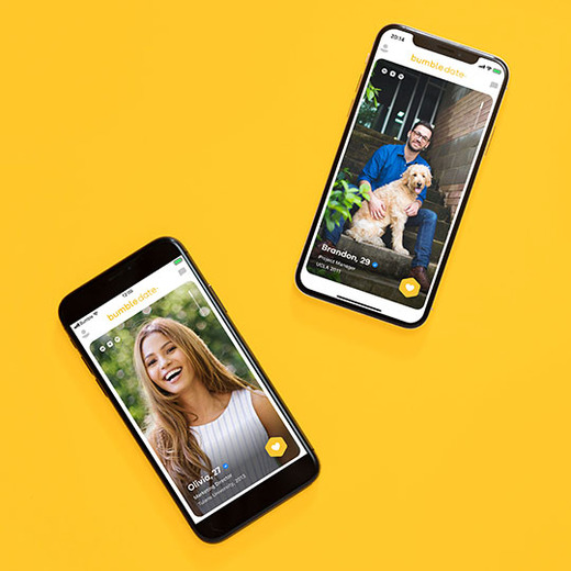 Bumble date male and female profile screens open on smartphones set on yellow background