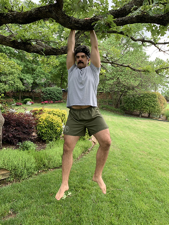 A man hanging with a tree.